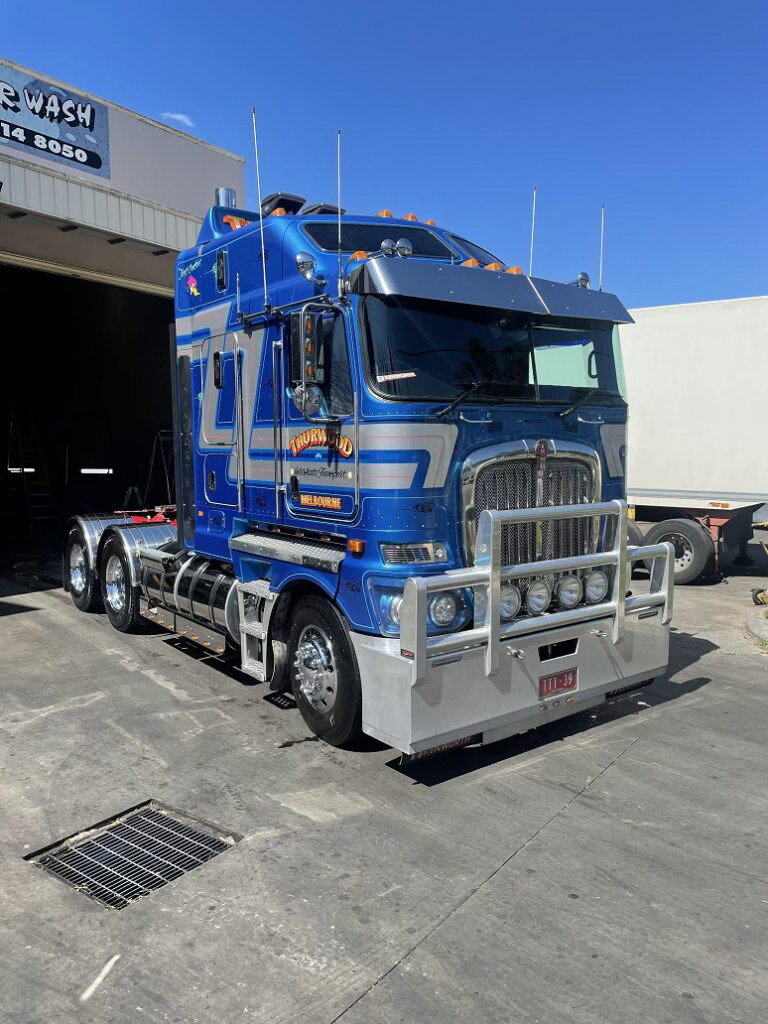 Blue semi-truck washing bay at Shine Express